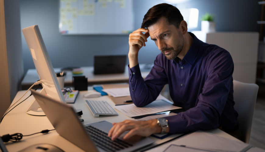 man looking at computer