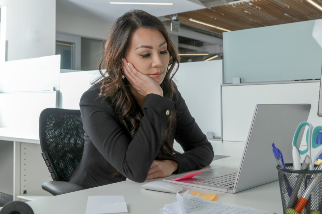 woman bored at desk
