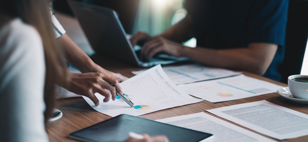 someone writing on documents